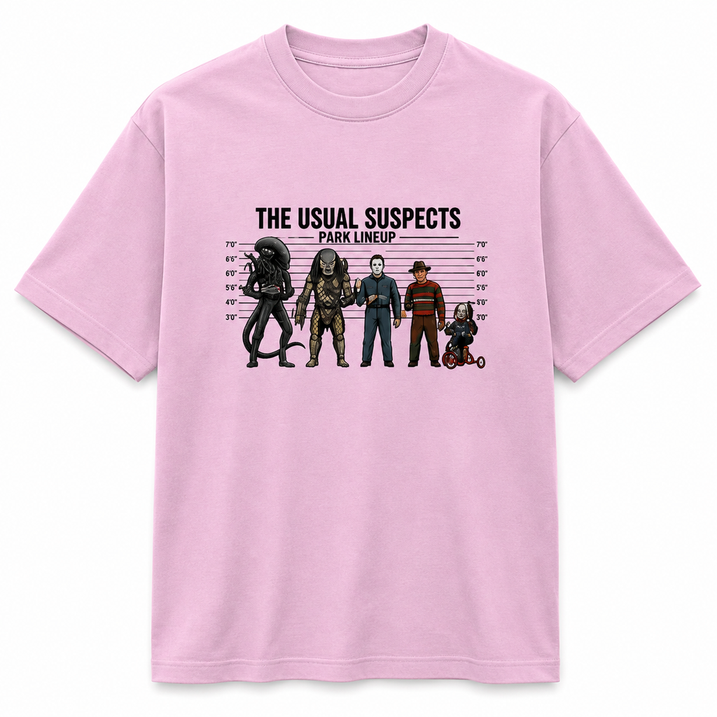 A light pink short-sleeve crewneck t-shirt featuring a graphic print of horror movie villains in a mugshot lineup with the text 'THE USUAL SUSPECTS PARK LINEUP'.