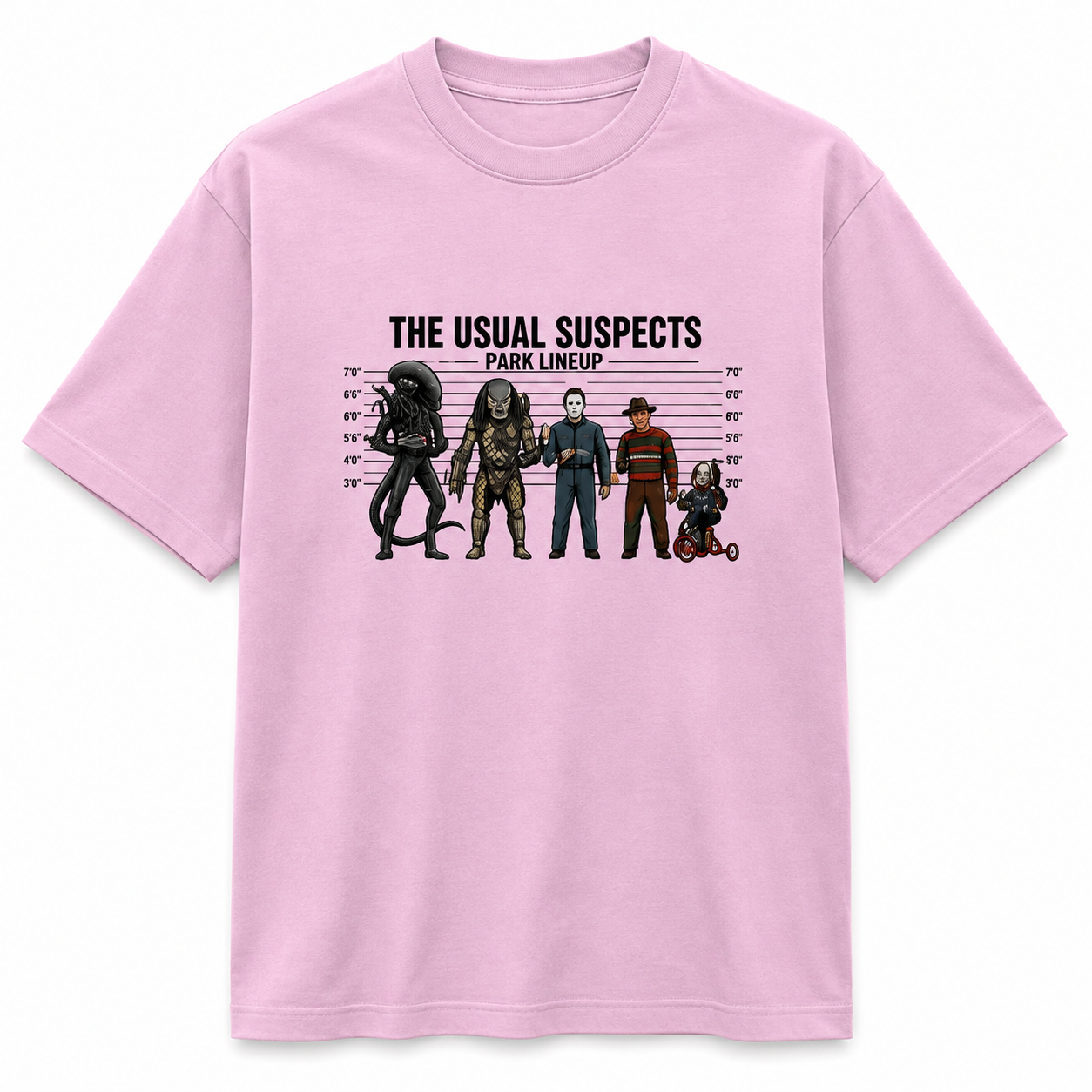 A light pink short-sleeve crewneck t-shirt featuring a graphic print of horror movie villains in a mugshot lineup with the text 'THE USUAL SUSPECTS PARK LINEUP'.
